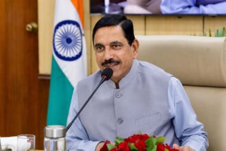 Pralhad Joshi addressing a meeting after taking charge as India's new Education Minister in New Delhi.